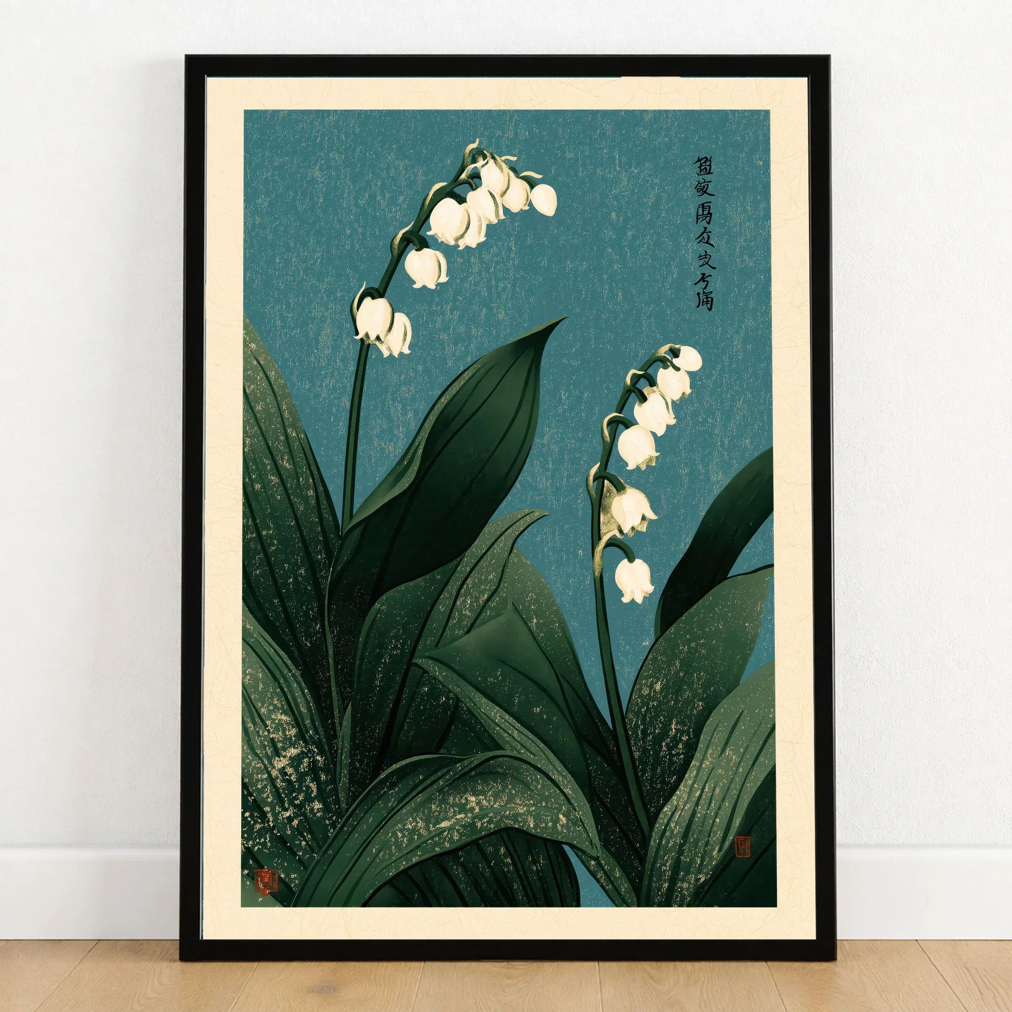 Lily of the Valley Wall Art – Vintage Japanese Botanical Print — art print in black frame on wooden floor