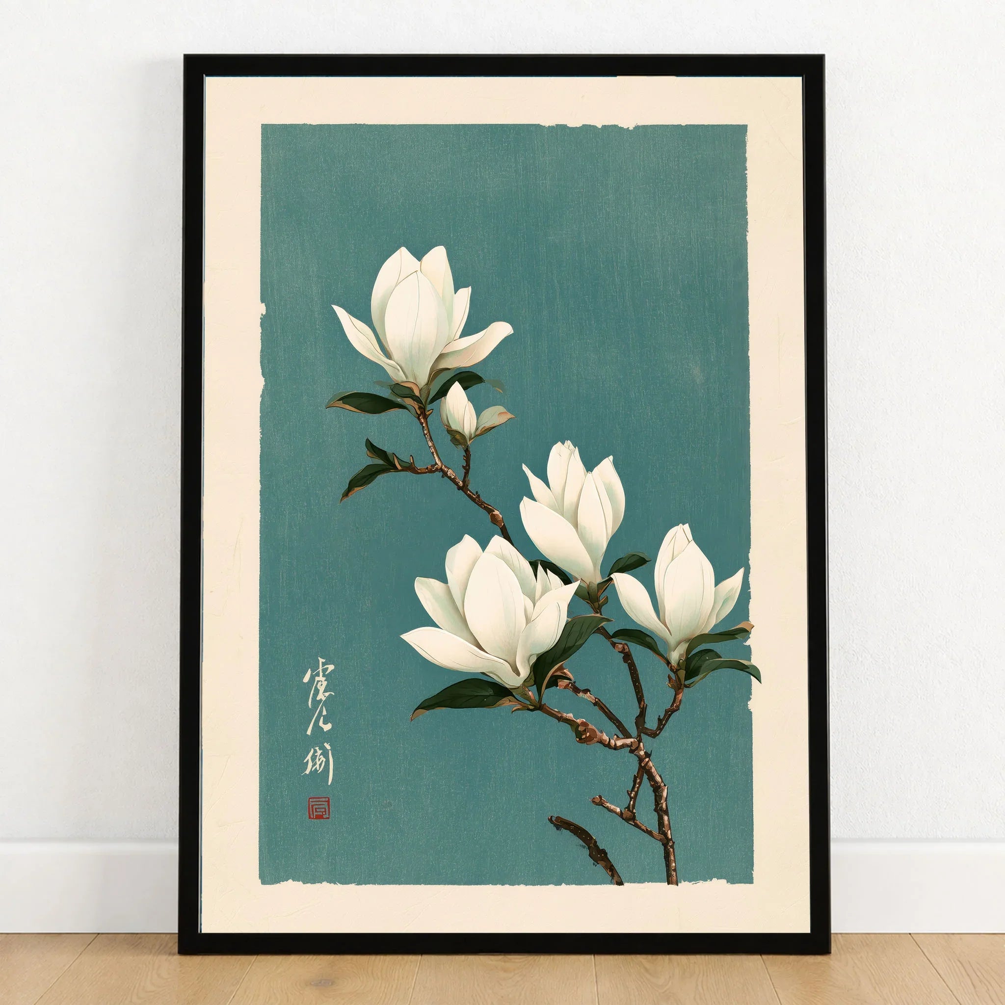 White Magnolia Art Print – Teal Japanese Botanical Wall Art — art print in black frame on wooden floor