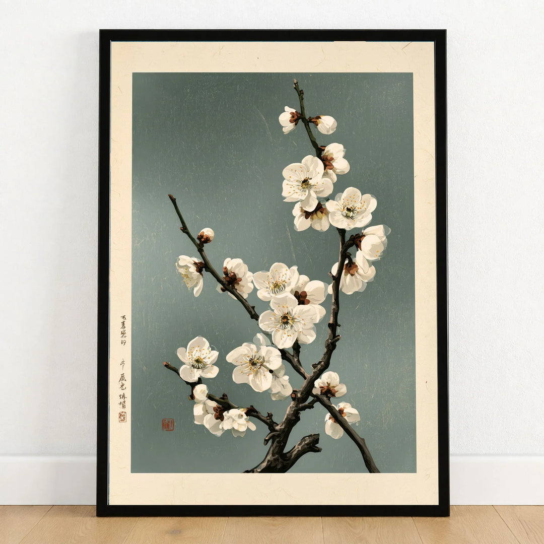 White Plum Blossom Art Print – Japanese Botanical Wall Art — art print in black frame on wooden floor