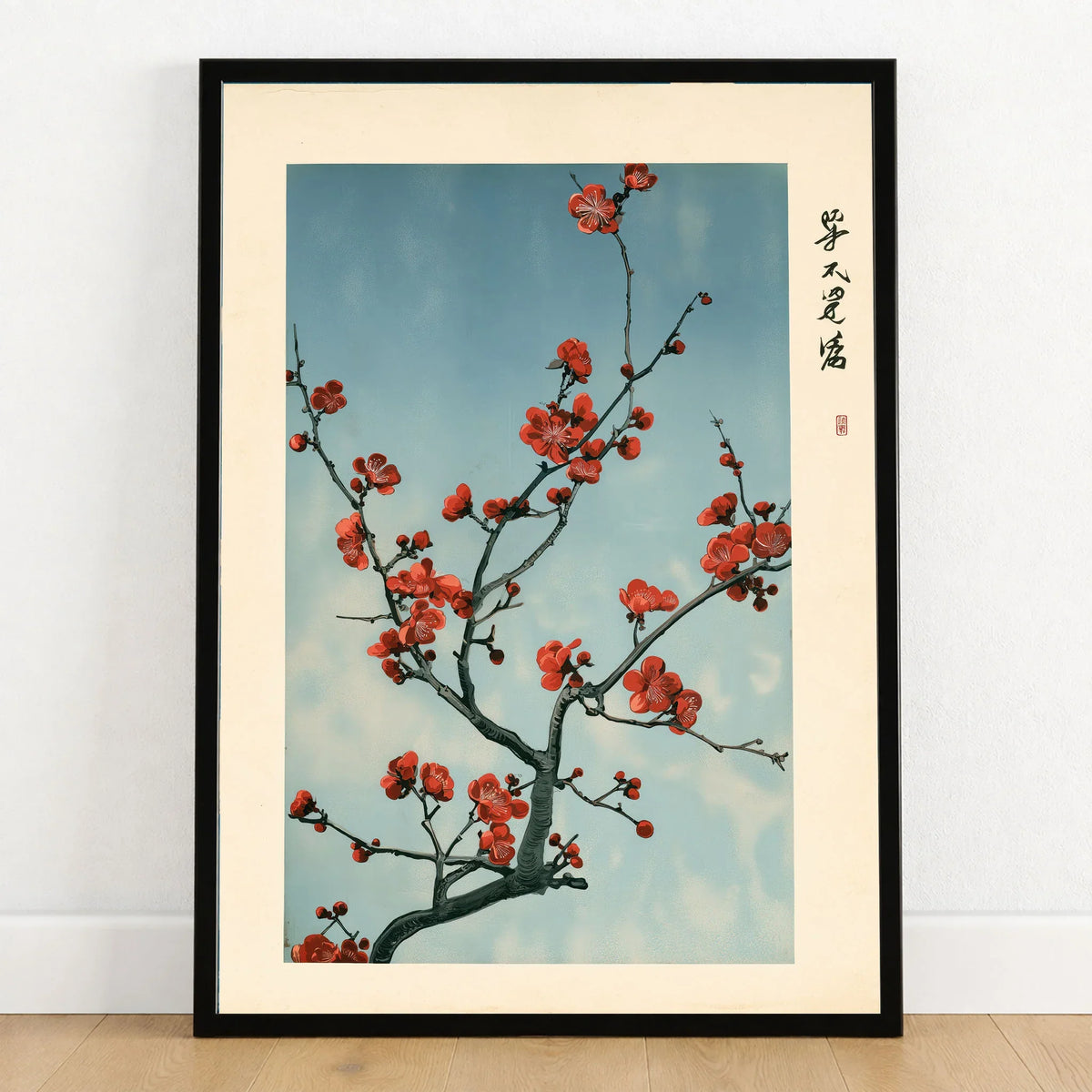 Red Plum Blossom Art Print – Blue Japanese Wall Art — art print in black frame on wooden floor