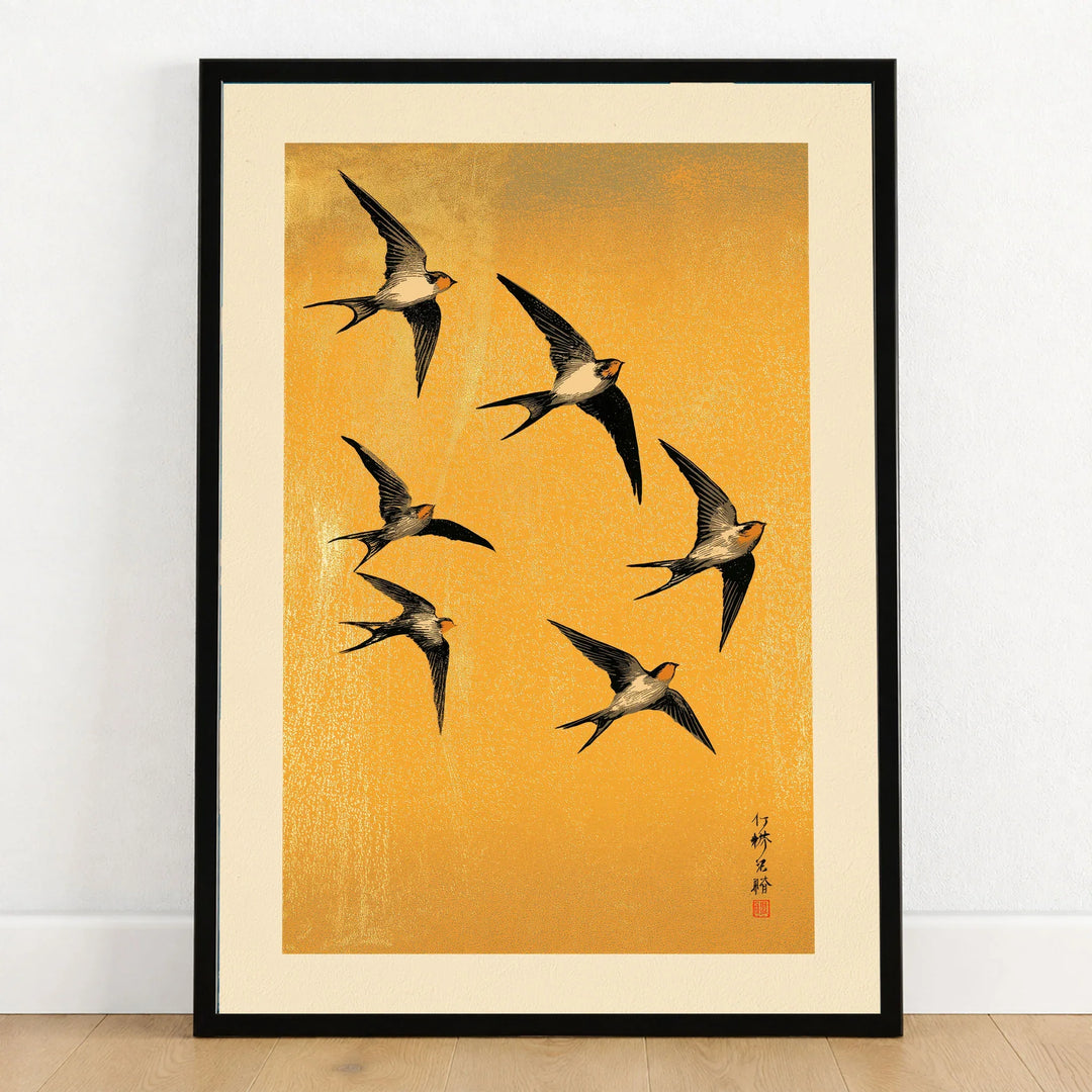 Swallows Art Print – Gold Japanese Bird Wall Art — art print in black frame on wooden floor