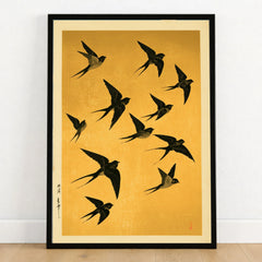 Flying Swallows Wall Art – Vintage Japanese Gold Print — art print in black frame on wooden floor