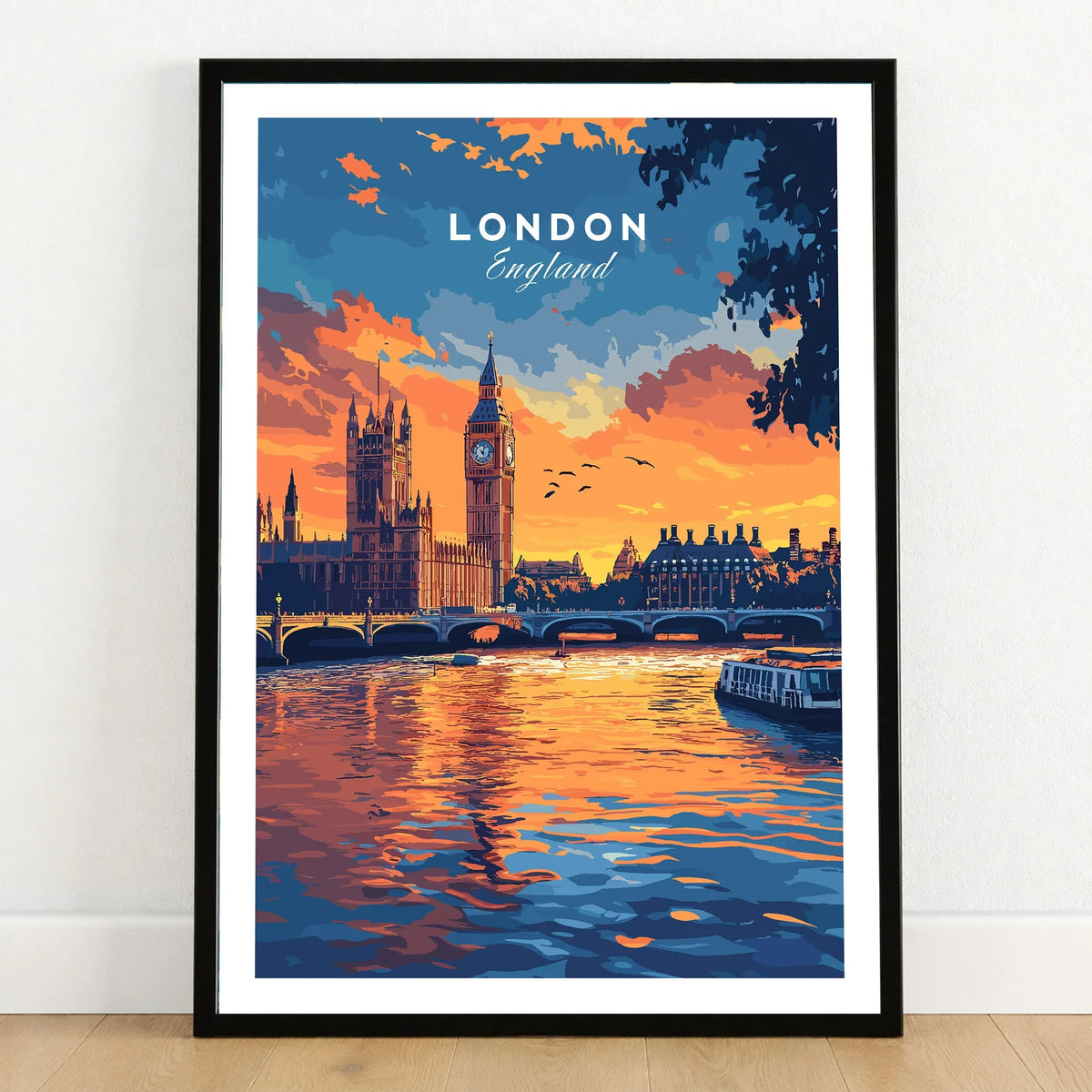 London Skyline Art | Big Ben & Houses of Parliament Print in a black wooden frame leaning against a white wall on a light wooden floor