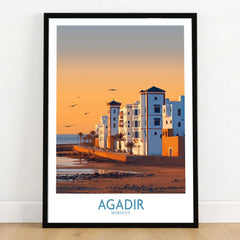 Agadir Morocco Wall Art in a black wooden frame leaning against a white wall on a light wooden floor