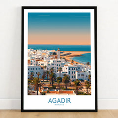 Agadir Morocco Wall Art – Mediterranean Canvas Art in a black wooden frame leaning against a white wall on a light wooden floor