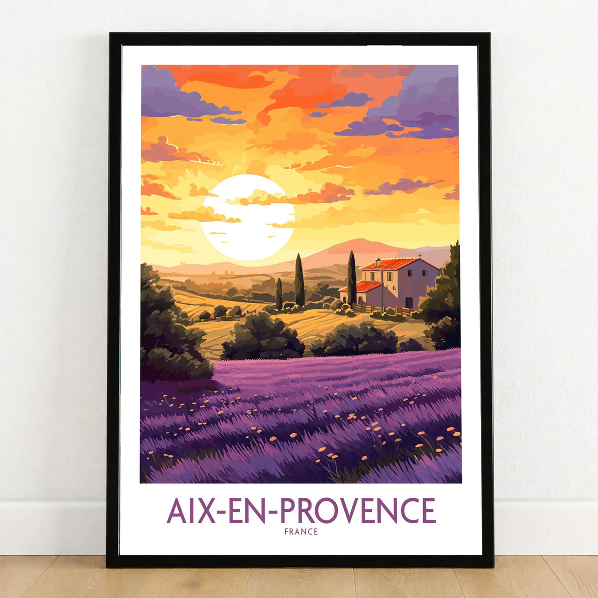 Aix-en-Provence Art Print in a black wooden frame leaning against a white wall on a light wooden floor
