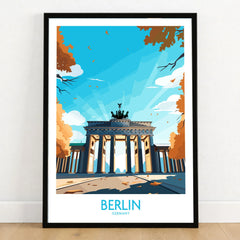 Berlin Wall Art Modern in a black wooden frame leaning against a white wall on a light wooden floor