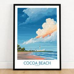 Cocoa Beach Kennedy Space Center Poster - Florida Wall Art Decor in a black wooden frame leaning against a white wall on a light wooden floor