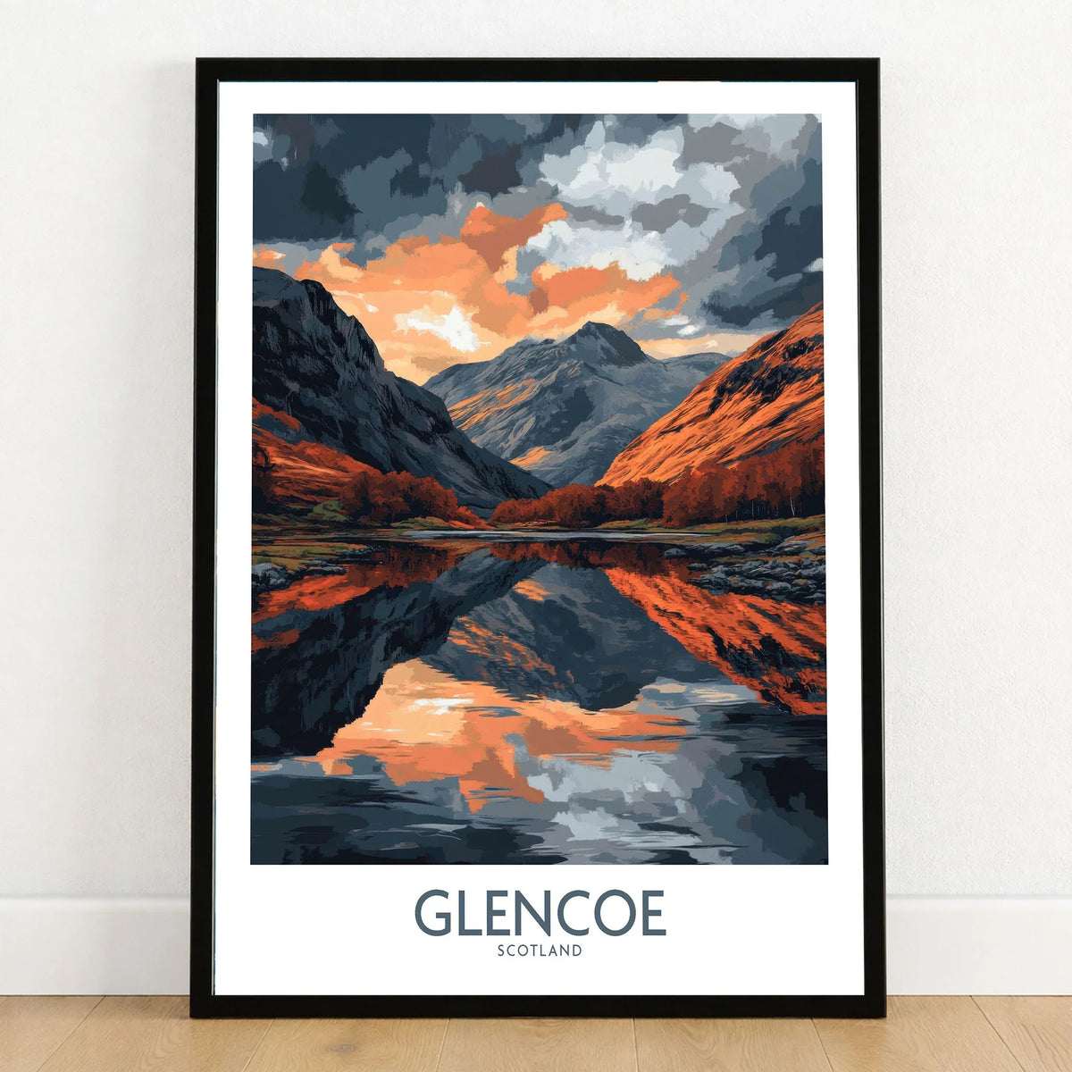 Glencoe Wall Art Poster in a black wooden frame leaning against a white wall on a light wooden floor