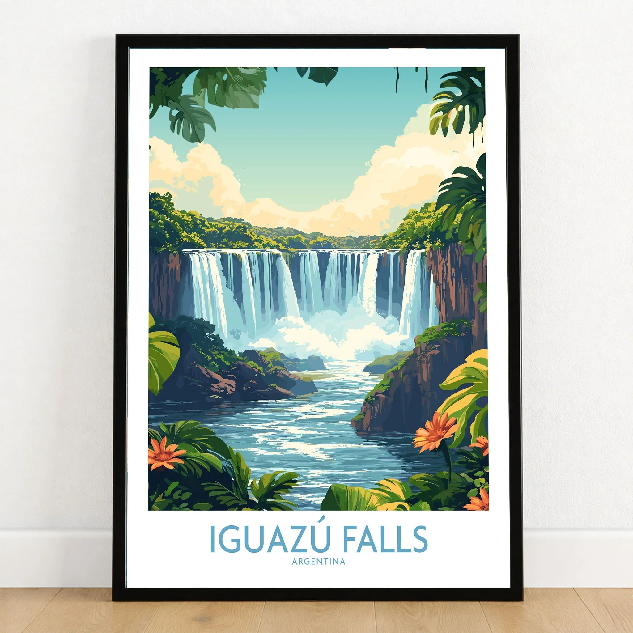 Iguazu Falls Poster Argentina in a black wooden frame leaning against a white wall on a light wooden floor