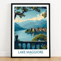 Lake Maggiore Poster Italy in a black wooden frame leaning against a white wall on a light wooden floor
