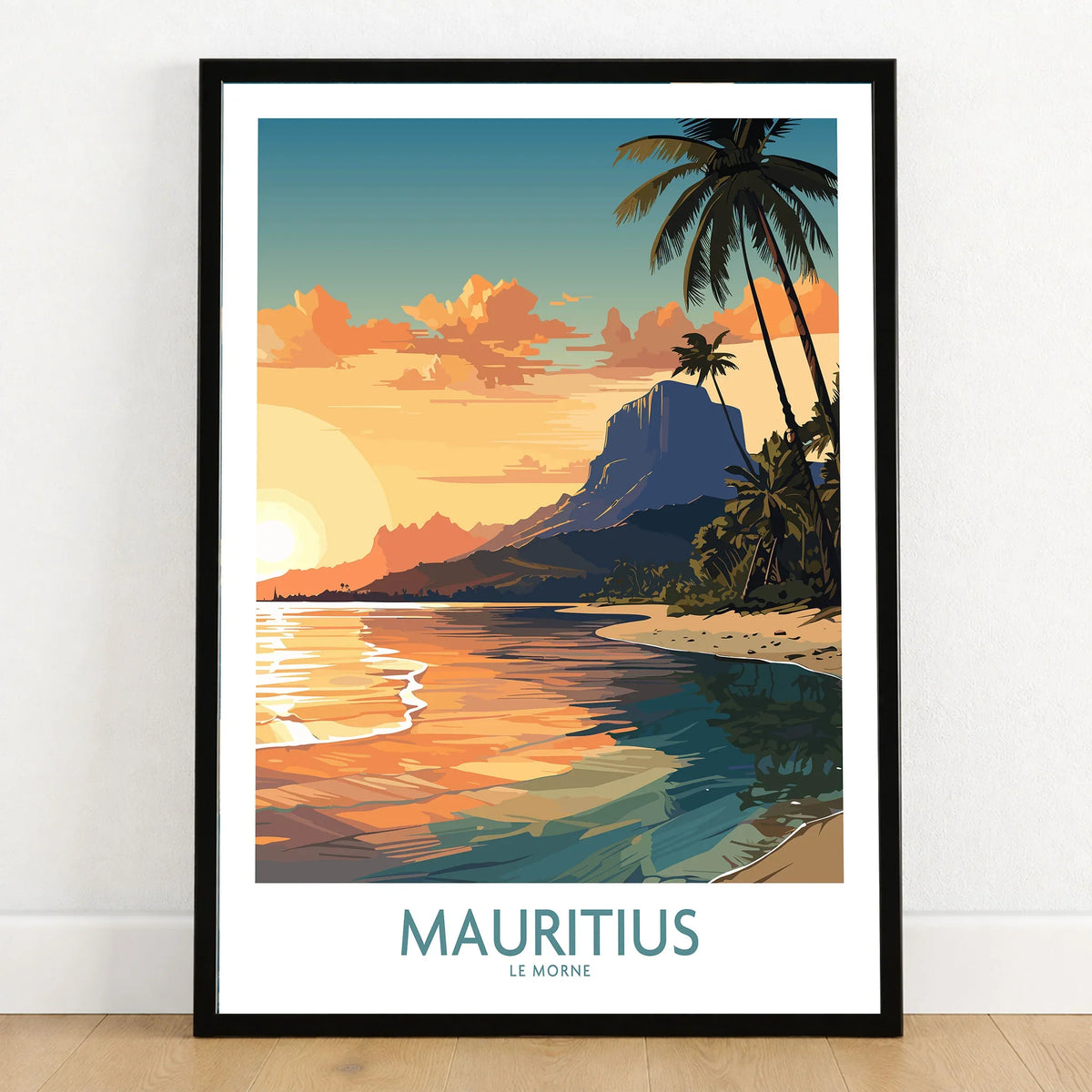 Le Morne Mauritius Wall Art in a black wooden frame leaning against a white wall on a light wooden floor