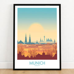 Munich Print Germany in a black wooden frame leaning against a white wall on a light wooden floor