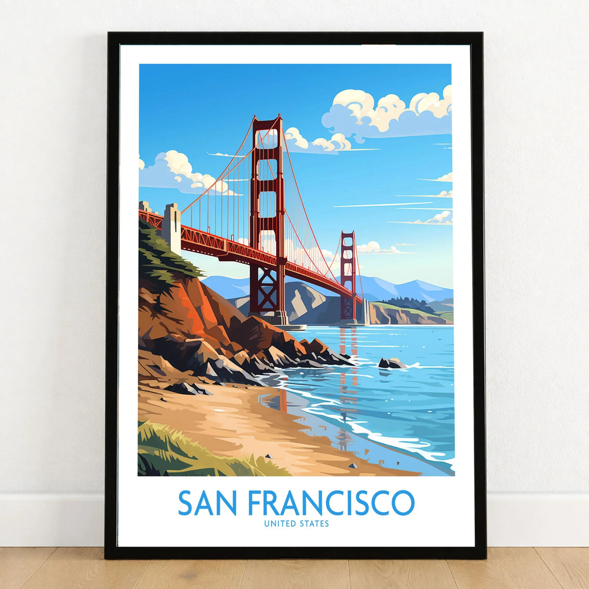 San Francisco Poster in a black wooden frame leaning against a white wall on a light wooden floor