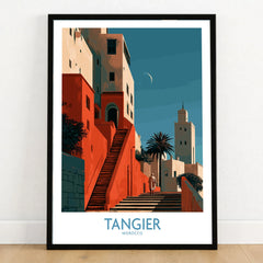 Tangier Morocco Crescent Moon Wall Art — coral kasbah steps climbing towards a minaret under a crescent moon, shown as art print in black frame on wooden floor