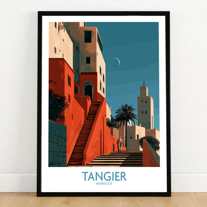 Tangier Morocco Crescent Moon Wall Art — coral kasbah steps climbing towards a minaret under a crescent moon, shown as art print in black frame on wooden floor