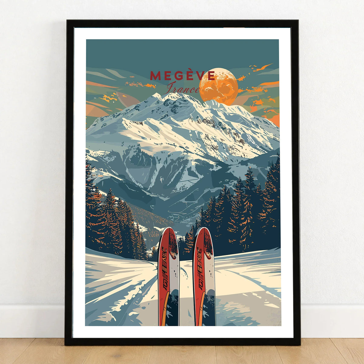 Megève Travel Poster - France in a black wooden frame leaning against a white wall on a light wooden floor