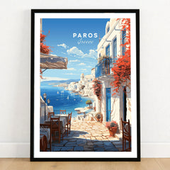 Paros Travel Poster in a black wooden frame leaning against a white wall on a light wooden floor