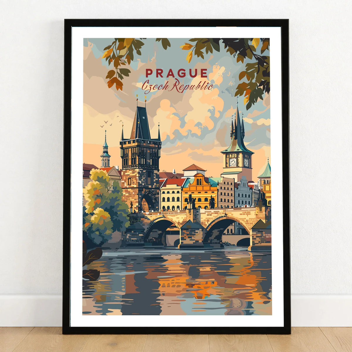 Prague Wall Art in a black wooden frame leaning against a white wall on a light wooden floor