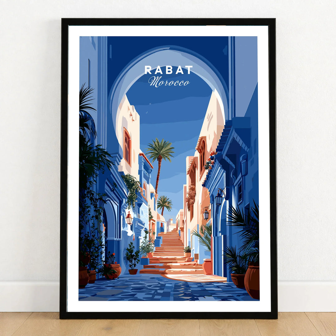 Rabat Morocco Blue Medina Travel Poster — a blue-washed medina lane and stone steps seen through a horseshoe arch, shown as art print in black frame on wooden floor
