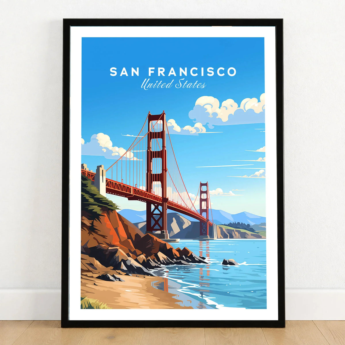 San Francisco Print in a black wooden frame leaning against a white wall on a light wooden floor
