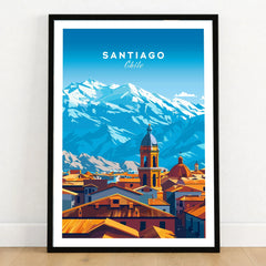 Santiago Travel Print - Chile Poster in a black wooden frame leaning against a white wall on a light wooden floor