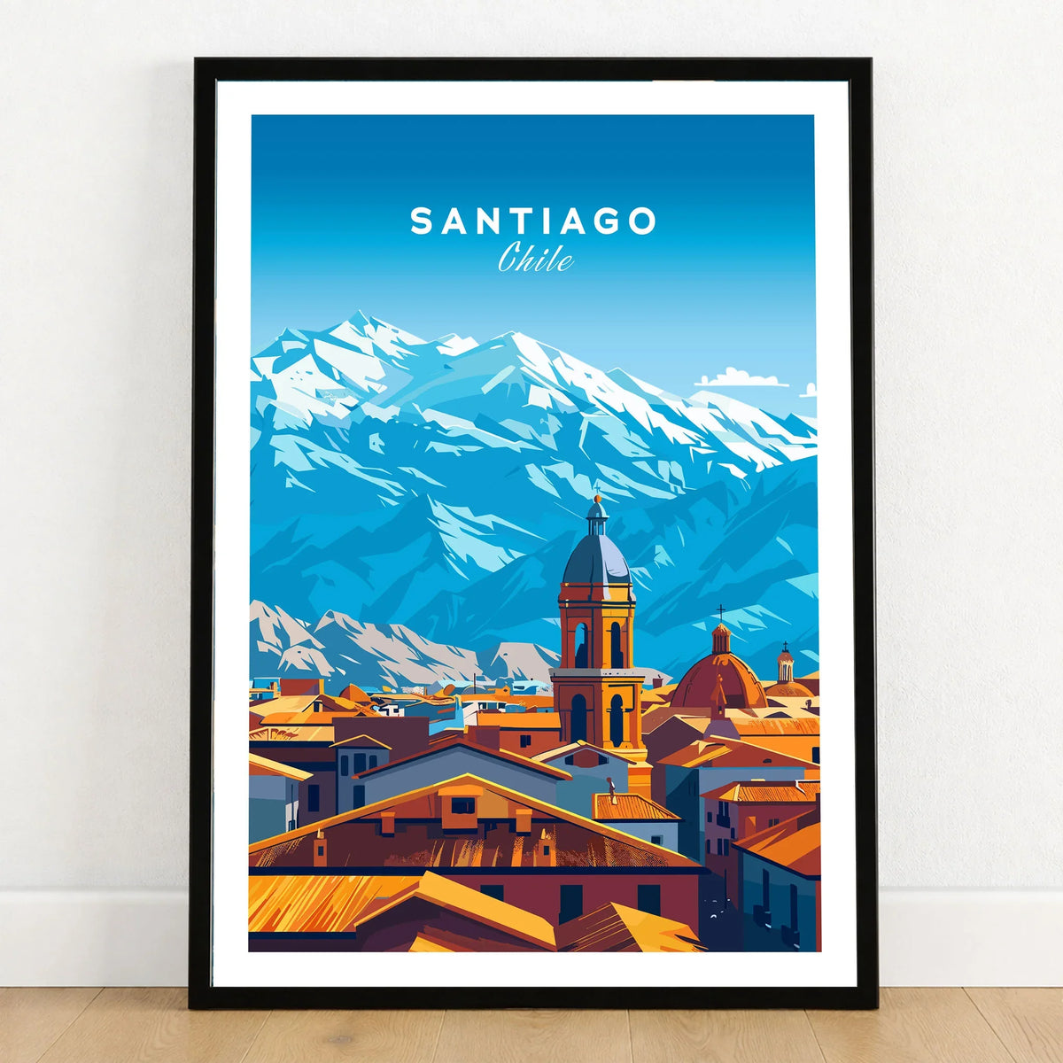 Santiago Travel Print - Chile Poster in a black wooden frame leaning against a white wall on a light wooden floor