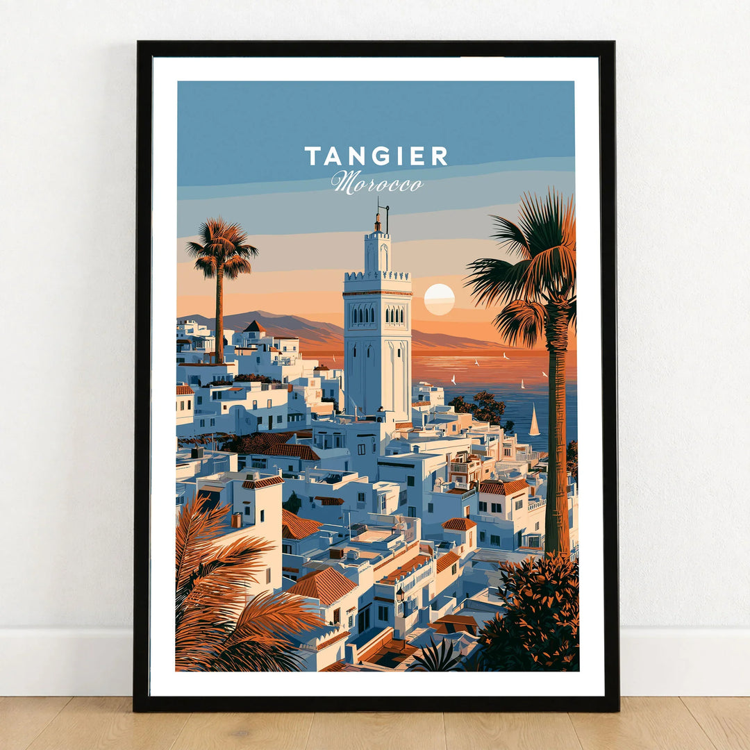 Tangier Morocco Sunset Medina Travel Poster — Tangier medina rooftops and a minaret above a bay dotted with sails, shown as art print in black frame on wooden floor