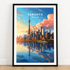 Toronto Poster in a black wooden frame leaning against a white wall on a light wooden floor