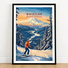 Whistler Travel Poster -  British Columbia in a black wooden frame leaning against a white wall on a light wooden floor