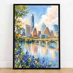 Austin skyline and Lady Bird Lake watercolour art print in a black frame on a wooden floor