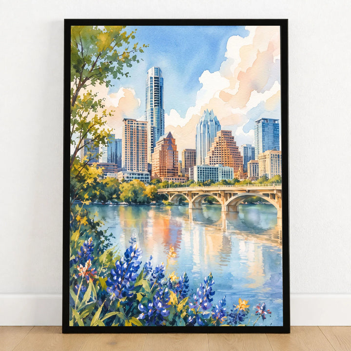 Austin skyline and Lady Bird Lake watercolour art print in a black frame on a wooden floor