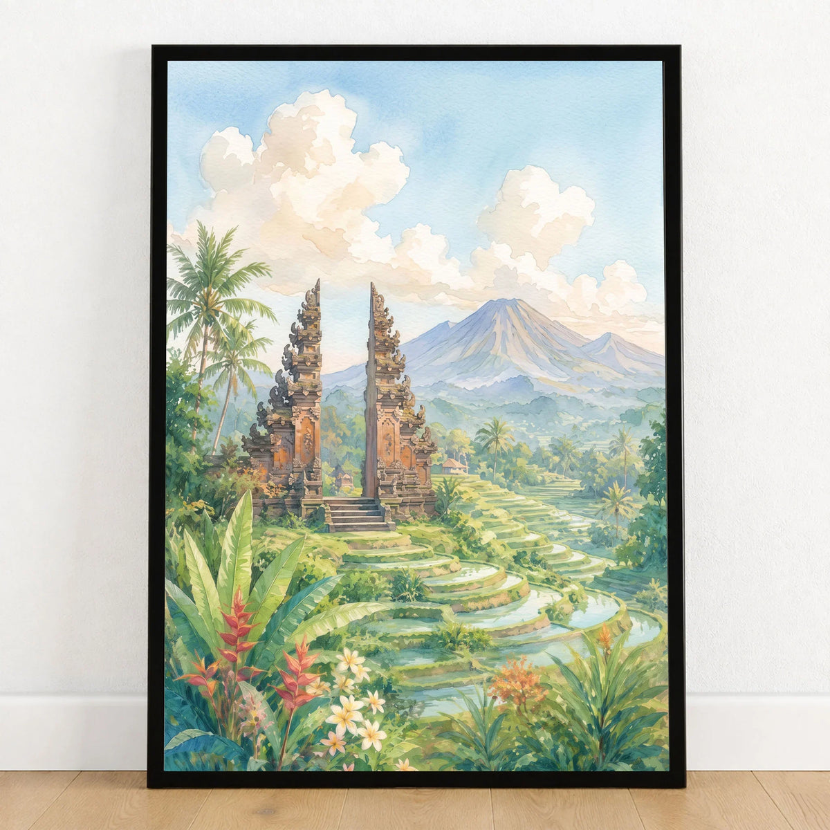 Bali temple gate and rice terraces watercolour art print in a black frame on a wooden floor