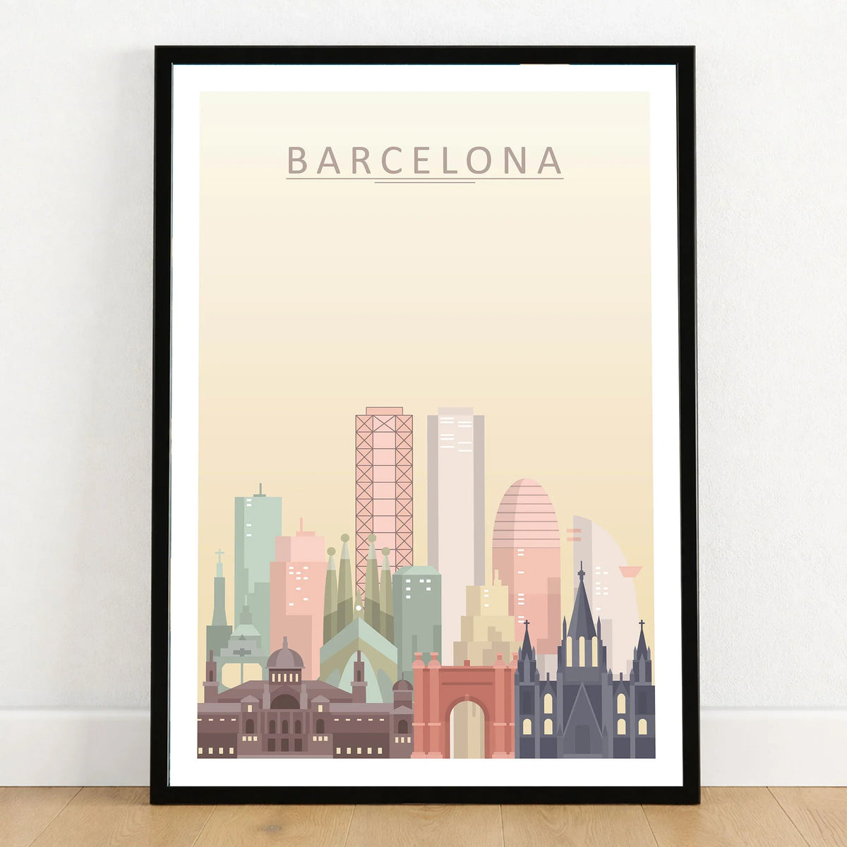 Barcelona city skyline art print in a black frame on a wooden floor
