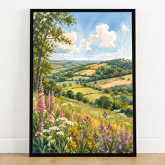 Blackdown Hills foxgloves and patchwork fields watercolour art print in a black frame on a wooden floor