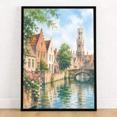 Bruges canal and Belfry tower watercolour art print in a black frame on a wooden floor