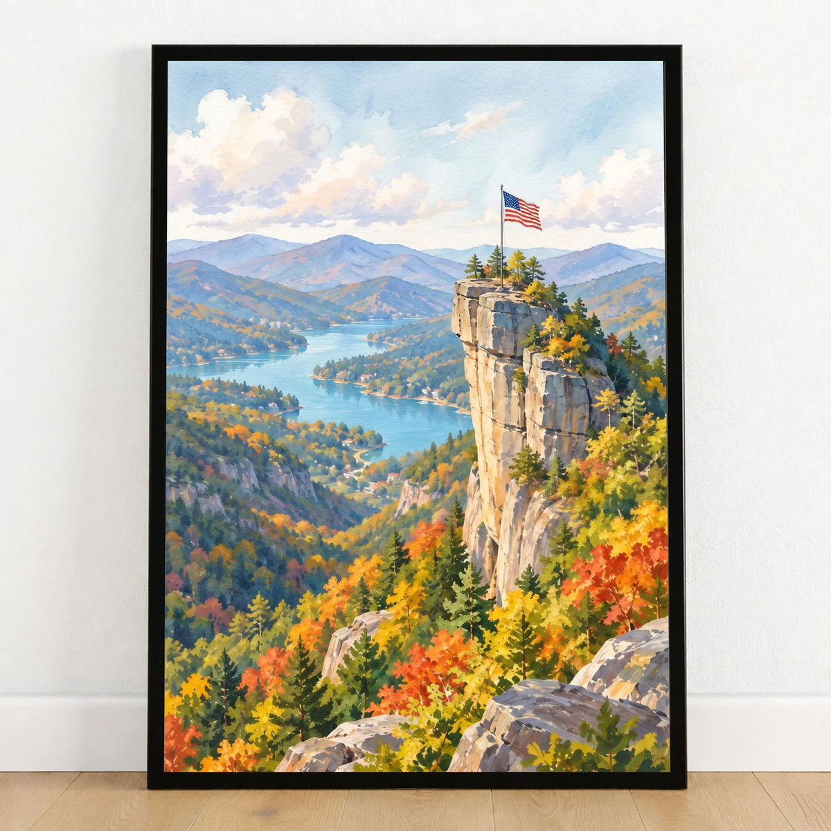 Chimney Rock State Park Chimney Rock above Lake Lure watercolour art print in a black frame on a wooden floor
