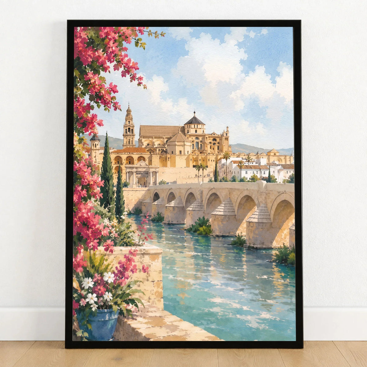 Córdoba Roman bridge and Mezquita watercolour art print in a black frame on a wooden floor