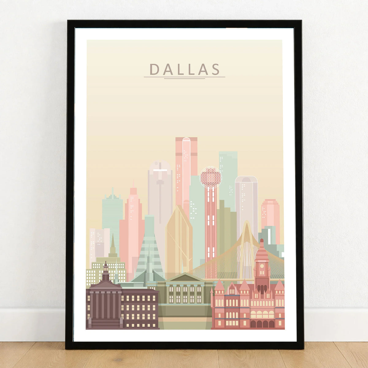 Dallas city skyline art print in a black frame on a wooden floor