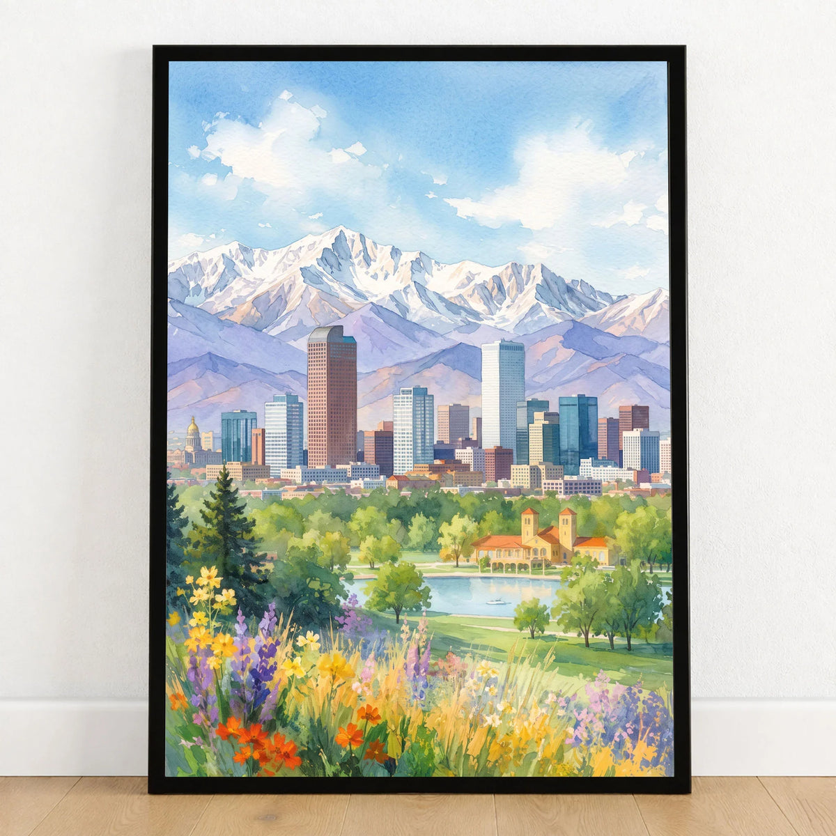 Denver skyline and Rocky Mountains watercolour art print in a black frame on a wooden floor