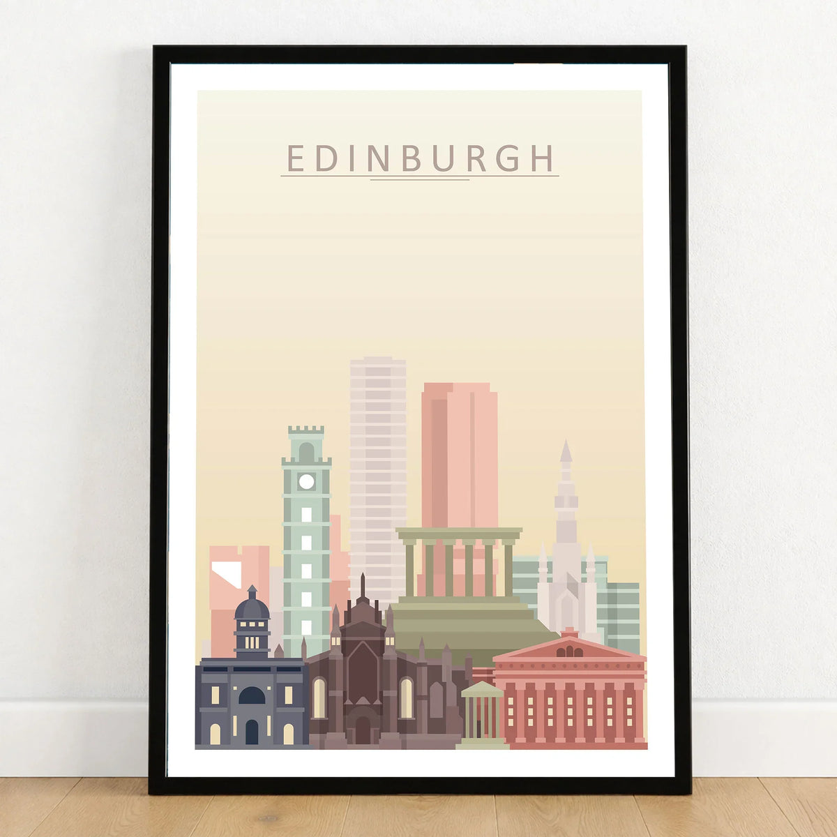 Edinburgh city skyline art print in a black frame on a wooden floor