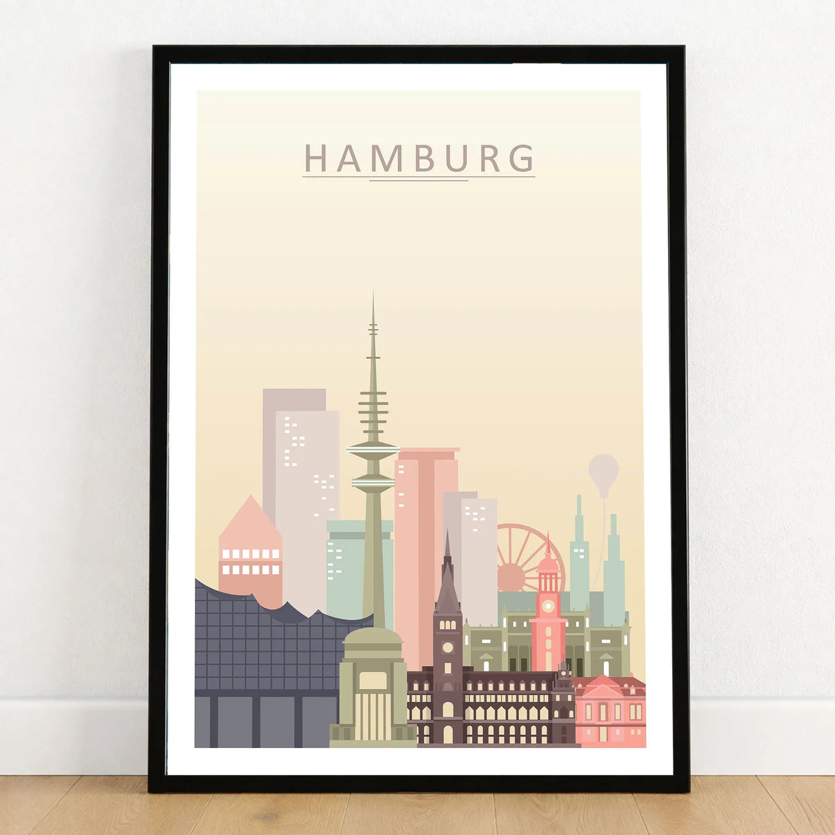 Hamburg city skyline art print in a black frame on a wooden floor