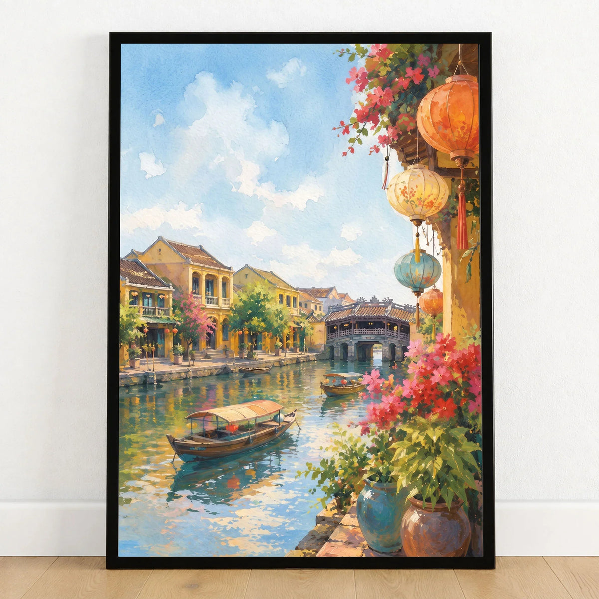 Hoi An lanterns and Japanese bridge watercolour art print in a black frame on a wooden floor
