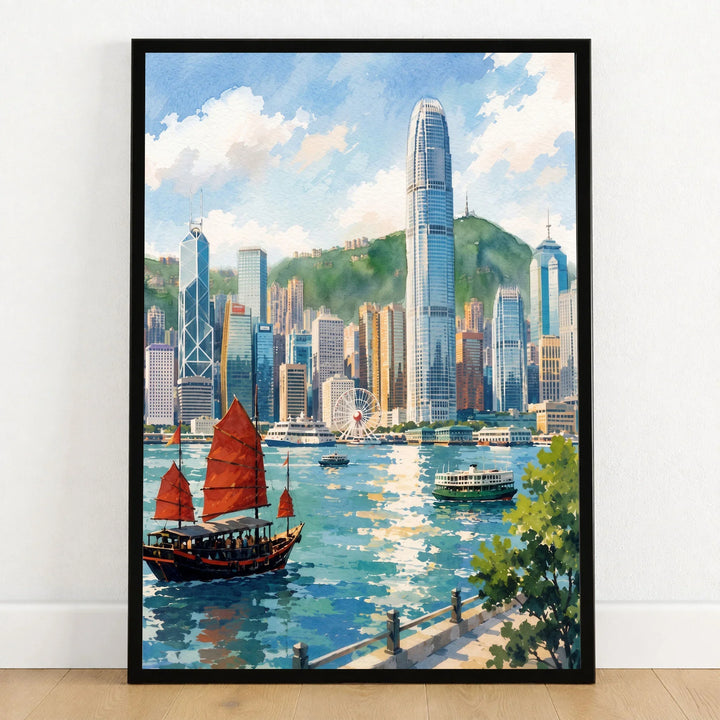 Hong Kong Victoria Harbour and junk boat watercolour art print in a black frame on a wooden floor