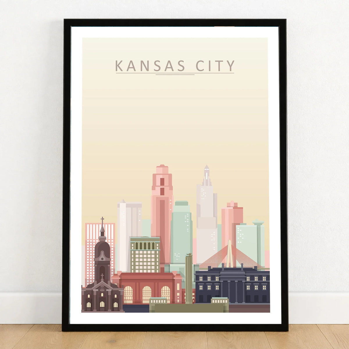 Kansas City city skyline art print in a black frame on a wooden floor