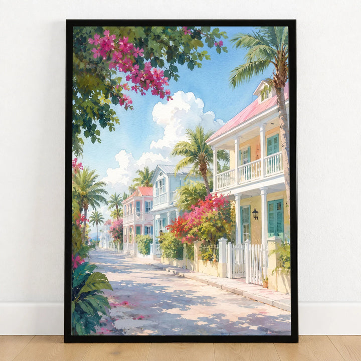 Key West pastel conch houses watercolour art print in a black frame on a wooden floor