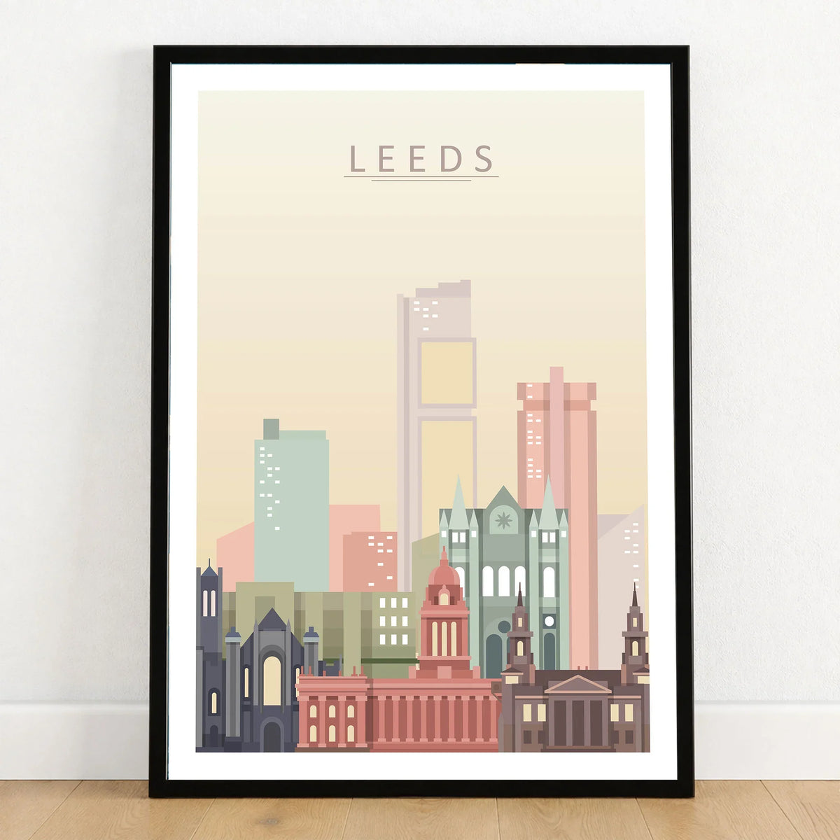 Leeds city skyline art print in a black frame on a wooden floor