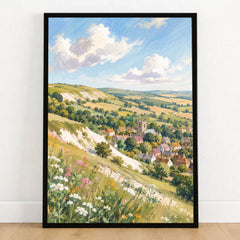 Lincolnshire Wolds hillside village and church watercolour art print in a black frame on a wooden floor