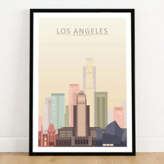 Los Angeles city skyline art print in a black frame on a wooden floor