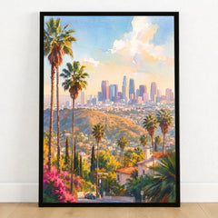 Los Angeles palm trees and downtown skyline watercolour art print in a black frame on a wooden floor